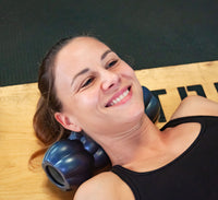 Female Athlete releasing tight neck muscles